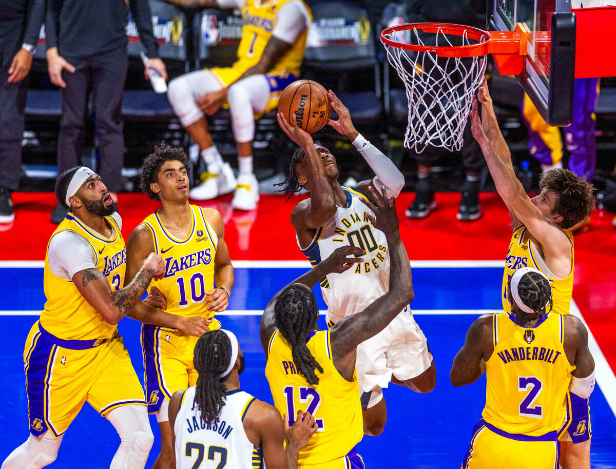 Indiana Pacers guard Bennedict Mathurin (00) looks to lay the ball in against Los Angeles Laker ...