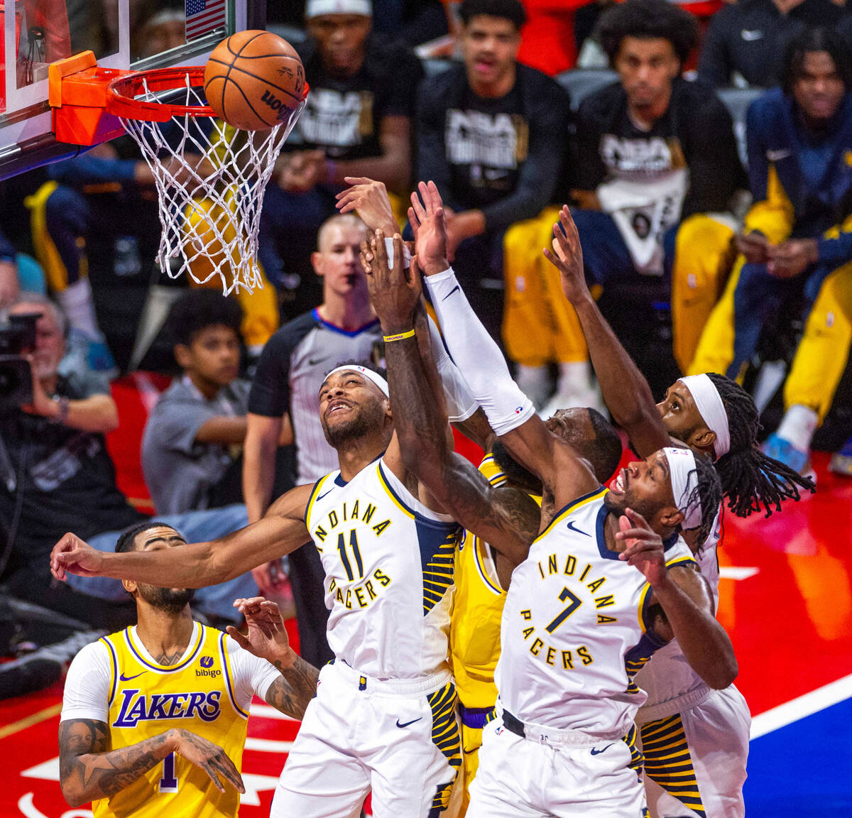 Indiana Pacers forward Bruce Brown (11) and guard Buddy Hield (7) fight with Los Angeles Lakers ...