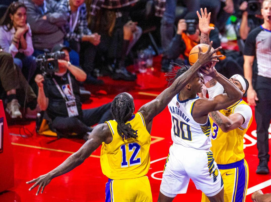 Indiana Pacers guard Bennedict Mathurin (00) has a shot blocked by Los Angeles Lakers forward T ...