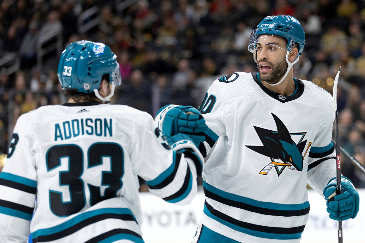 San Jose Sharks defenseman Calen Addison (33) and right wing Justin Bailey (90) celebrate a goa ...