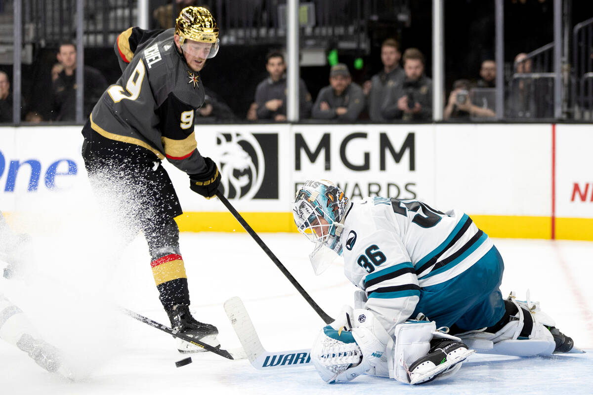 San Jose Sharks goaltender Kaapo Kahkonen (36) saves a shot on goal by Vegas Golden Knights cen ...