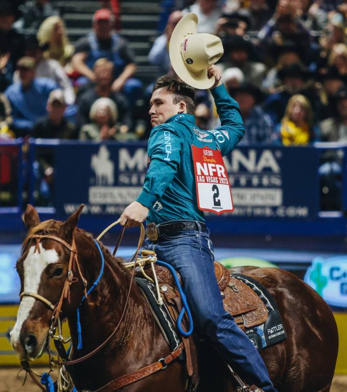 Riley Webb celebrates his time during the tie down roping portion of day three of the National ...