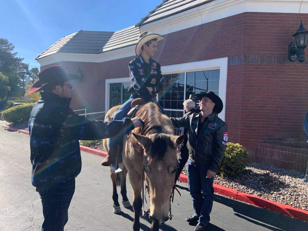 Angelo Mayorga rides tall in the saddle on Tater Tot, while Wrangler NFR cowboys Coleman Procto ...