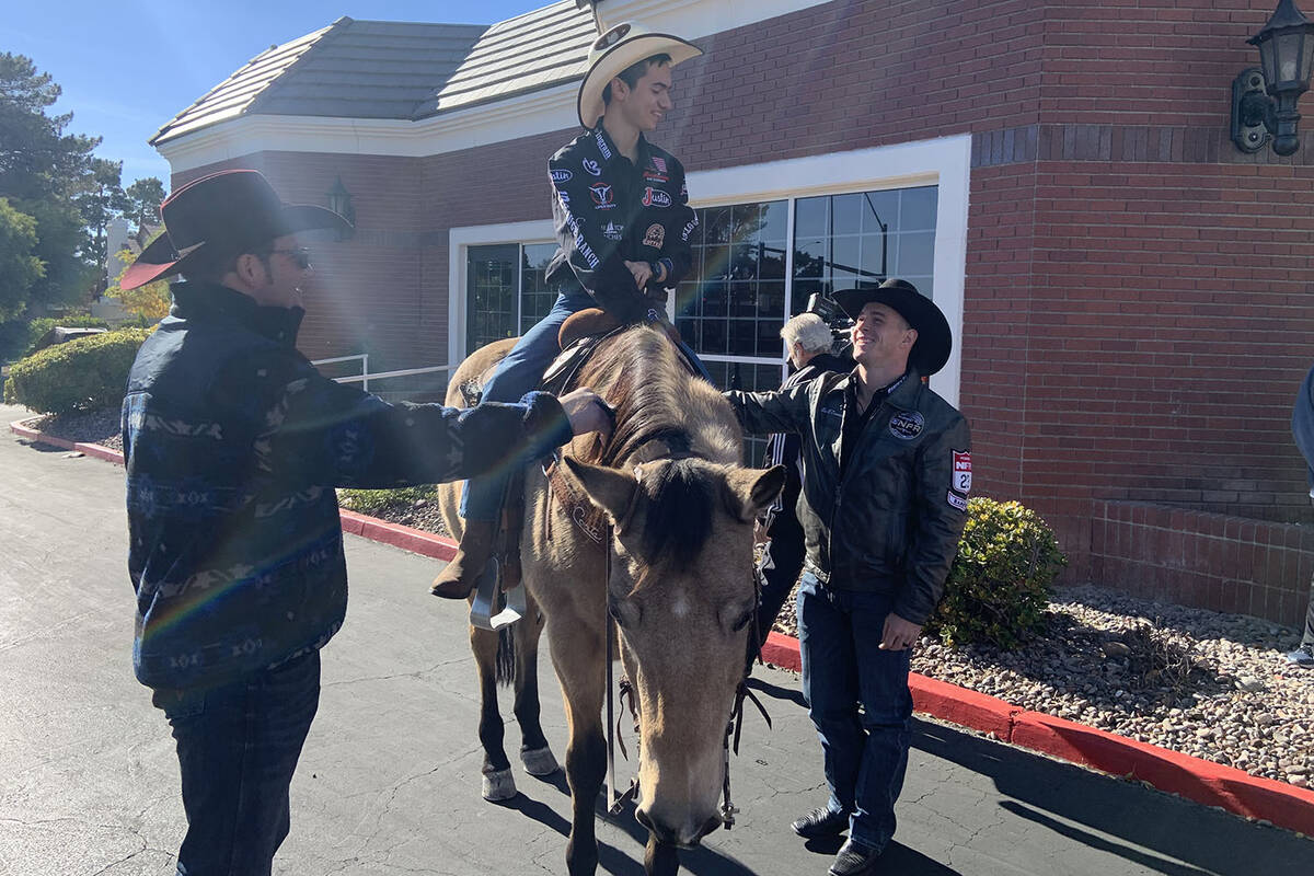 Angelo Mayorga rides tall in the saddle on Tater Tot, while Wrangler NFR cowboys Coleman Procto ...