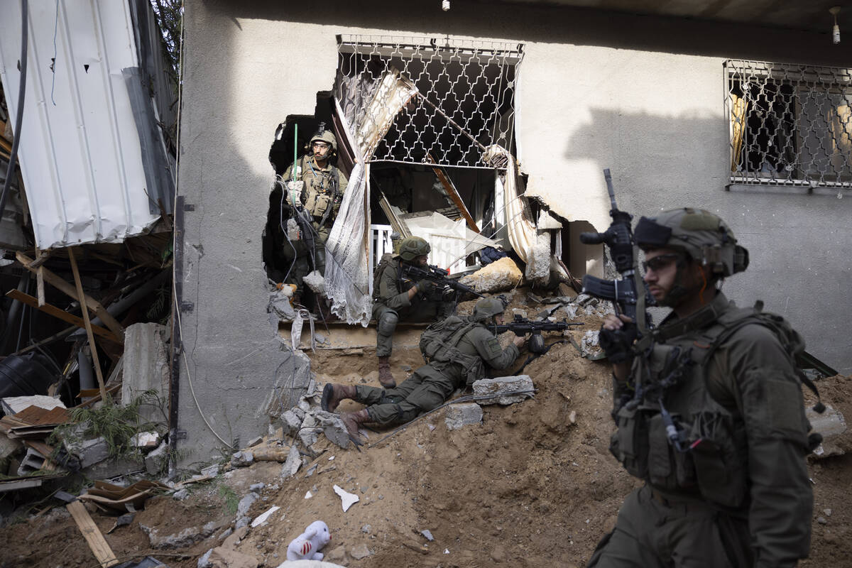 Israeli soldiers take part in a ground operation in Gaza City's Shijaiyah neighborhood, Friday, ...