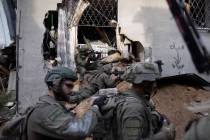 Israeli soldiers take part in a ground operation in Gaza City's Shijaiyah neighborhood, Friday, ...