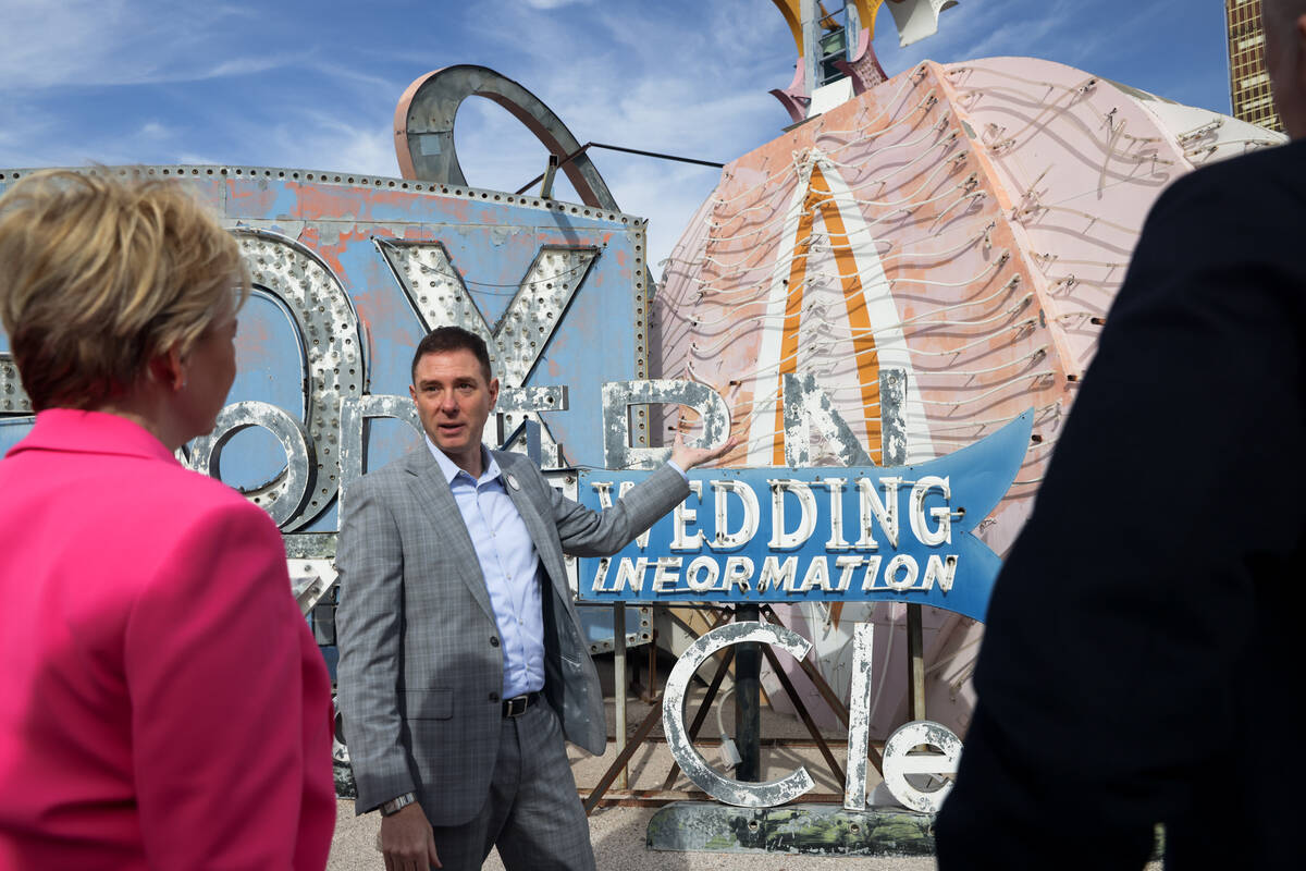 Aaron Berger, executive director of the Neon Museum, addresses donors and media in front of one ...