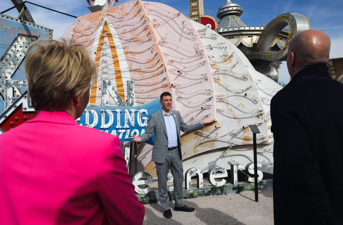 Aaron Berger, executive director of the Neon Museum, addresses donors and media in front of one ...
