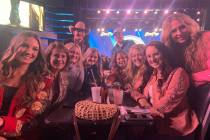 A hearty group of Wrangler NFR viewing party/after-party goers soaks in the vibe at the South P ...