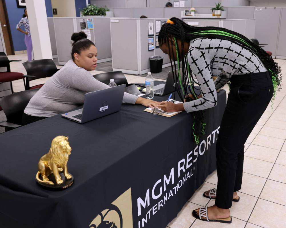 Job seeker Tieyana, 18, right, checks in with Shalynn Kelly during an MGM Resorts International ...