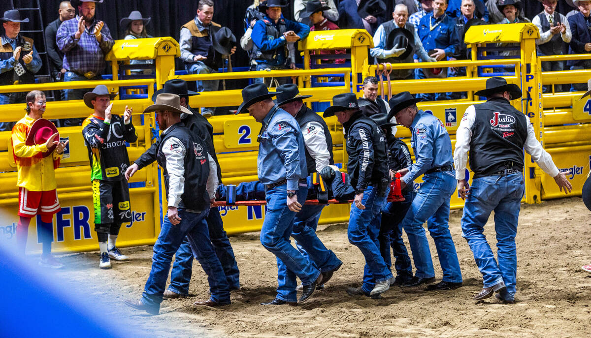 Ky Hamilton is carried out on a backboard after being thrown during Bull Riding during day 5 ac ...