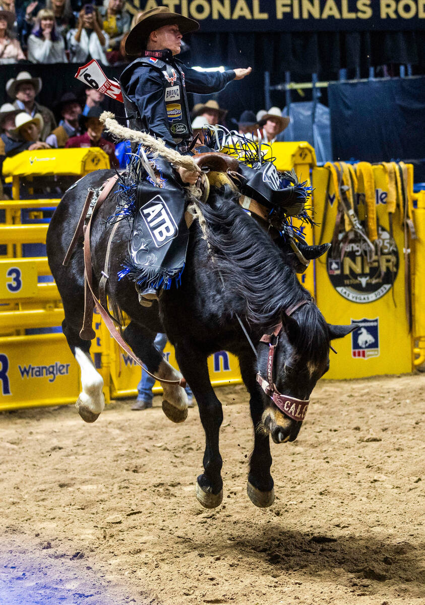 Zeke Thurston takes first place in Saddle Bronc Riding during day 5 action of the NFR at the Th ...