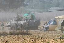 Israeli forces evacuate a wounded soldier from Gaza, near the border between Gaza and southern ...