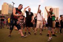People dance to Leftover Crack performing during the Punk Rock Bowling Music Festival at the Do ...