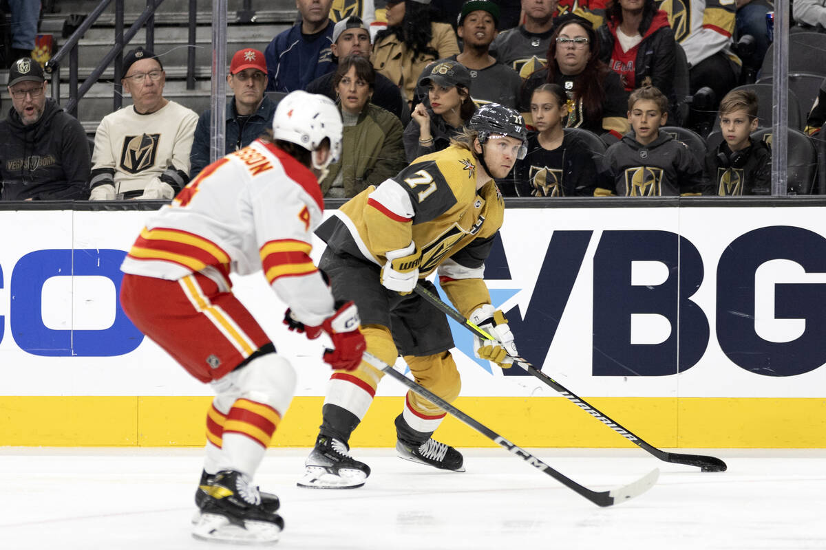 Golden Knights center William Karlsson (71) skates for the net against Flames defenseman Rasmus ...