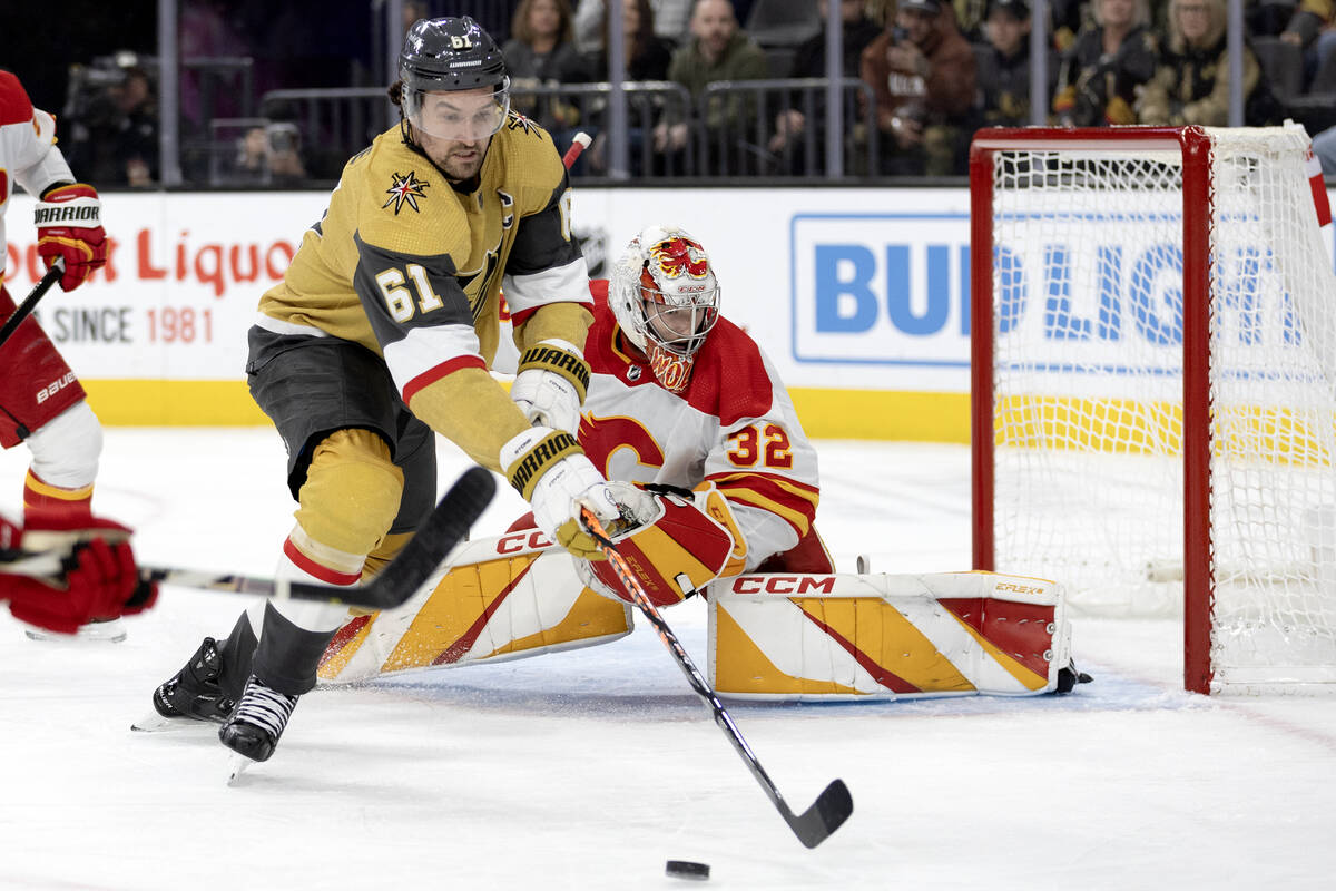 Golden Knights right wing Mark Stone (61) receives a pass while Flames goaltender Dustin Wolf ( ...