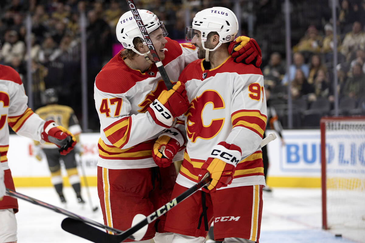 Flames center Connor Zary (47) and Flames center Nazem Kadri (91) celebrate Kadri’s goal ...