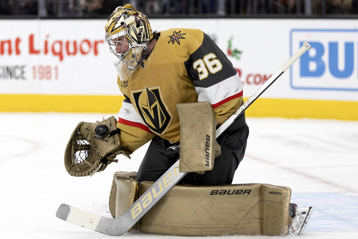 Golden Knights goaltender Logan Thompson (36) saves the puck during the second period of an NHL ...