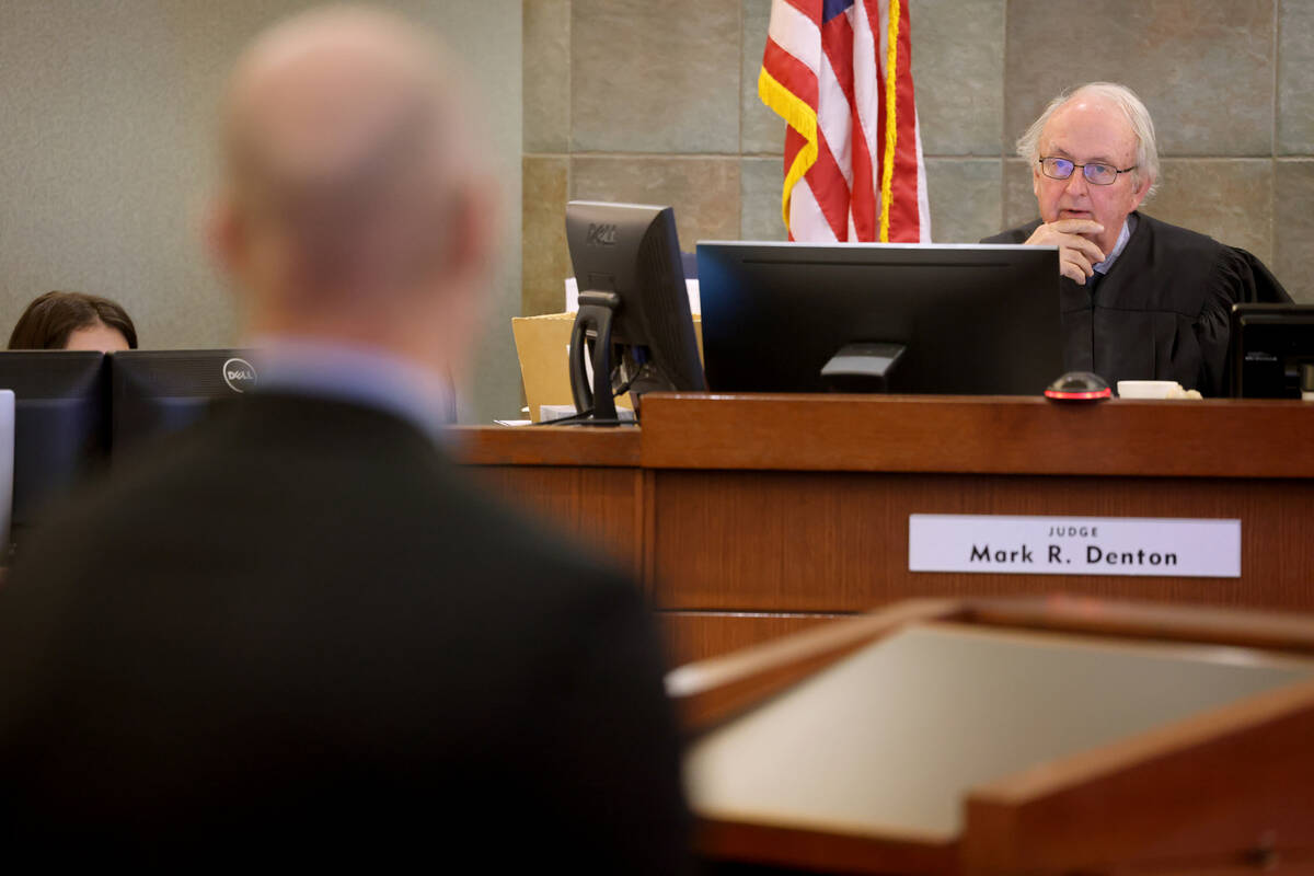 Clark County District Judge Mark Denton listens to William Schuller, an attorney representing t ...