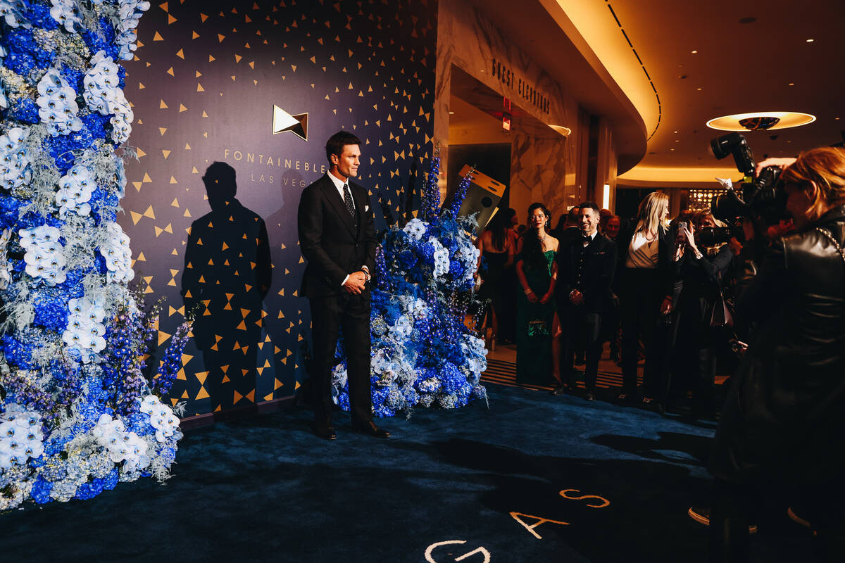 Tom Brady poses for photographs at the Fontainebleau “Bleau carpet” event on Wed ...