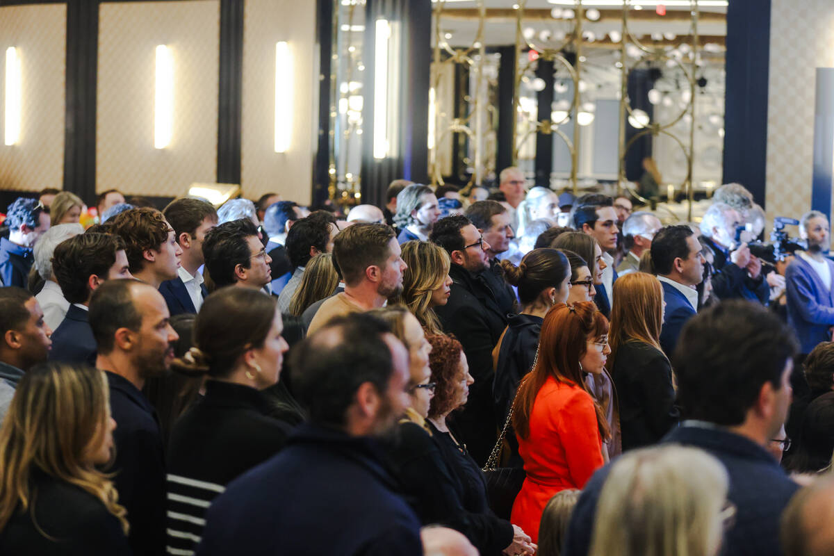 Guests watch the ribbon cutting ceremony for Fontainebleau Las Vegas, Wednesday, Dec. 13, 2023. ...