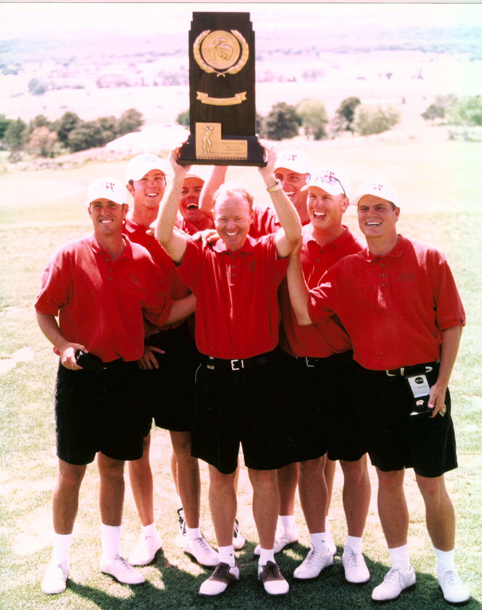 Members of the 1998 UNLV men's golf team with the NCAA championship trophy, from left, Chris Be ...
