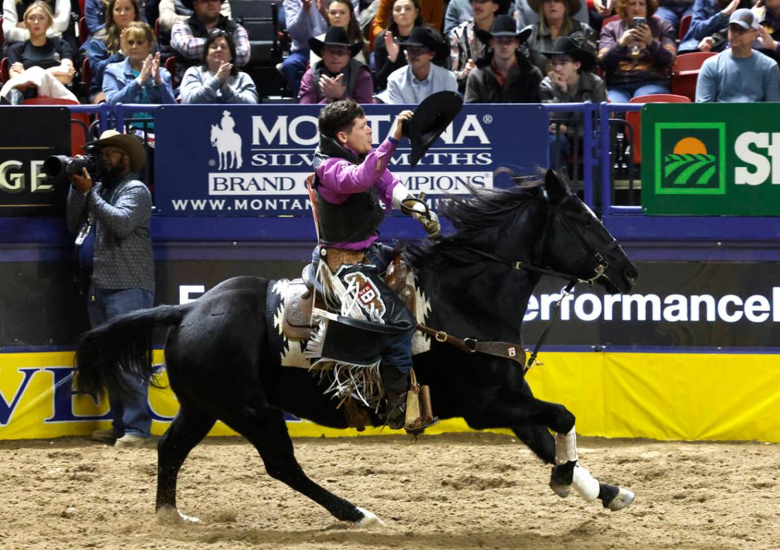 Tanner Aus reacts after sharing a first place win in bareback riding with Lacob Lees on day six ...