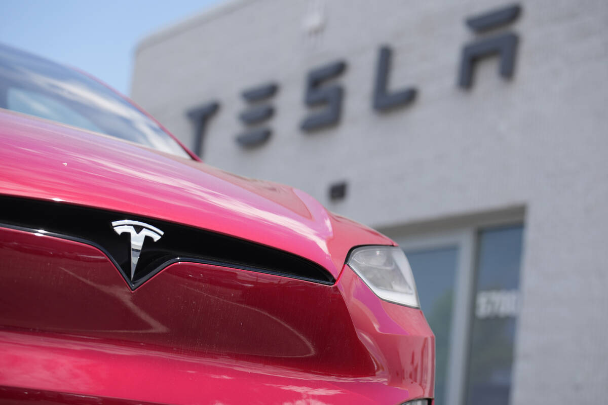 File - An unsold 2023 Model X sports-utility vehicle sits outside a Tesla dealership June 18, 2 ...