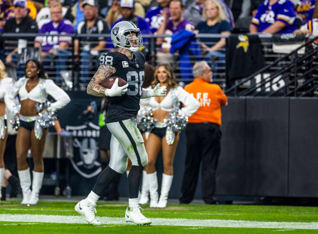 Raiders defensive end Maxx Crosby (98) runs with a ball he thought was fumbled by Minnesota Vik ...