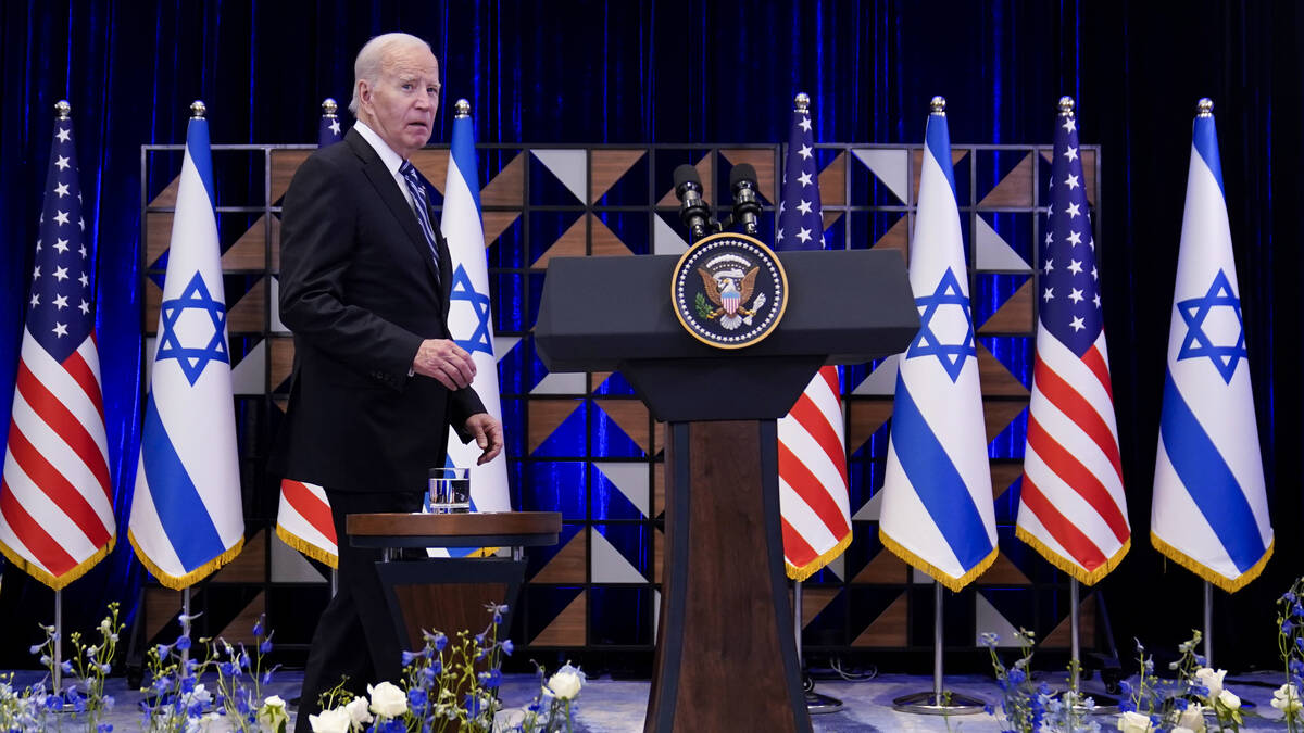 FILE - President Joe Biden walks to the podium to deliver remarks on the war between Israel and ...