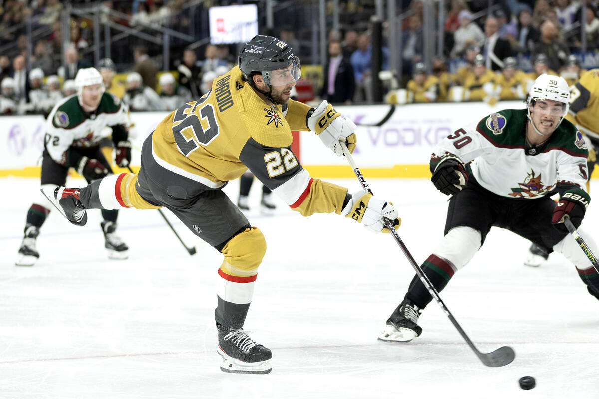 Golden Knights right wing Michael Amadio (22) attempts a goal while Coyotes defenseman Sean Dur ...