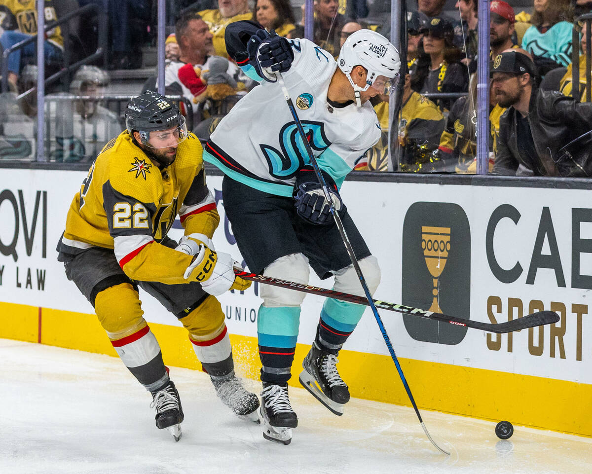 Golden Knights right wing Michael Amadio (22) closes in on Seattle Kraken defenseman Brian Dumo ...