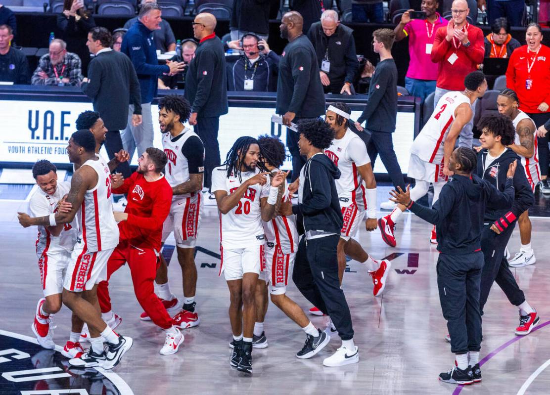 The UNLV Rebels celebrate their win over the Creighton Bluejays 79-64 ending the second half of ...