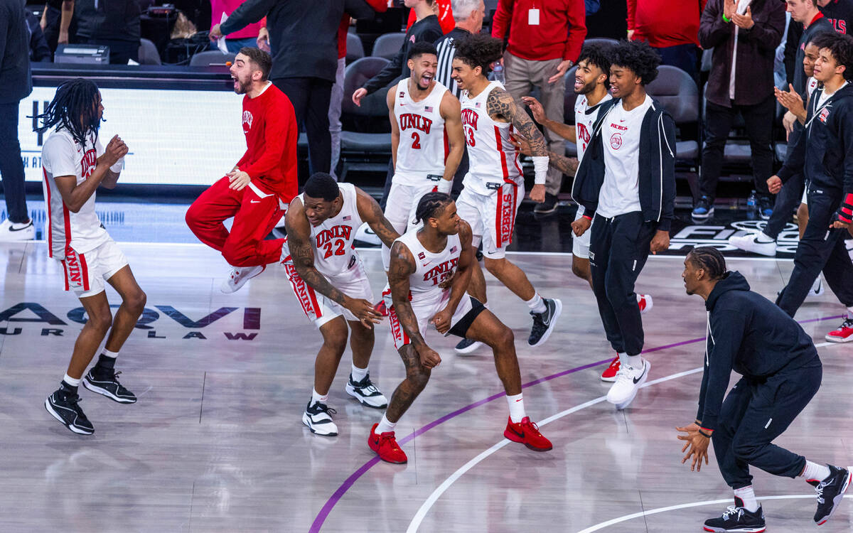 The UNLV Rebels celebrate their win over the Creighton Bluejays 79-64 ending the second half of ...