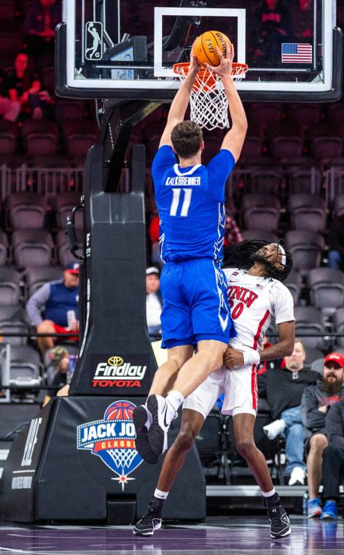 Creighton Bluejays center Ryan Kalkbrenner (11) dunks the ball over UNLV Rebels forward Keylan ...