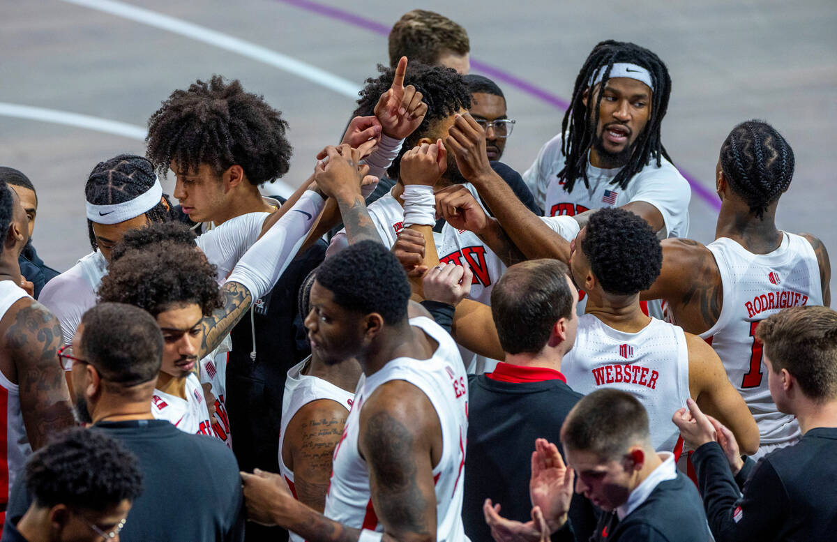 UNLV Rebels players gather in a huddle against the Creighton Bluejays during the second half of ...