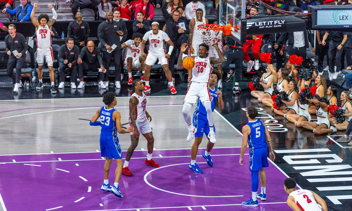 UNLV Rebels forward Kalib Boone (10) makes a big dunk late against Creighton Bluejays guard Tre ...