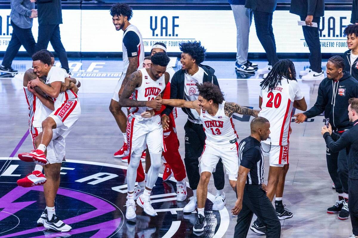 The UNLV Rebels celebrate their win over the Creighton Bluejays 79-64 ending the second half of ...