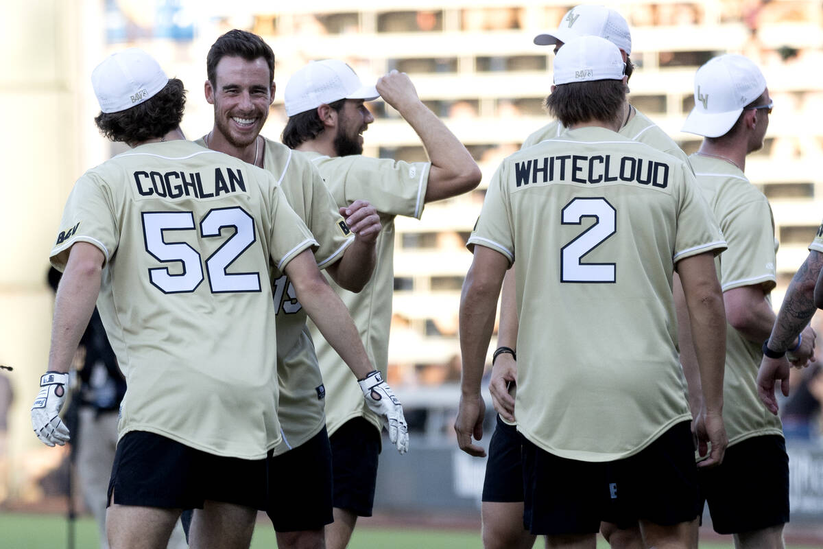 Former Golden Knights Dylan Coghlan (52) and Reilly Smith, second from left, celebrate after Co ...