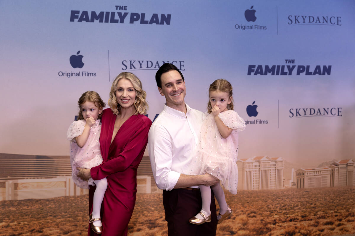 Actresses Iliana Norris, left, who is held by her mother, and Vienna Norris, right, who is held ...