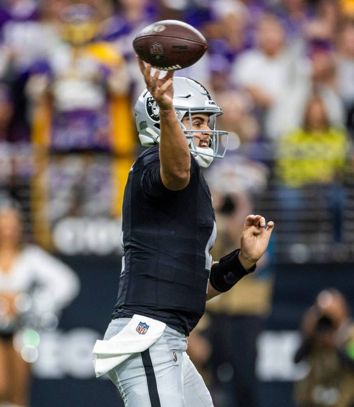 Raiders quarterback Aidan O'Connell (4) gets off a pass against the Minnesota Vikings during th ...