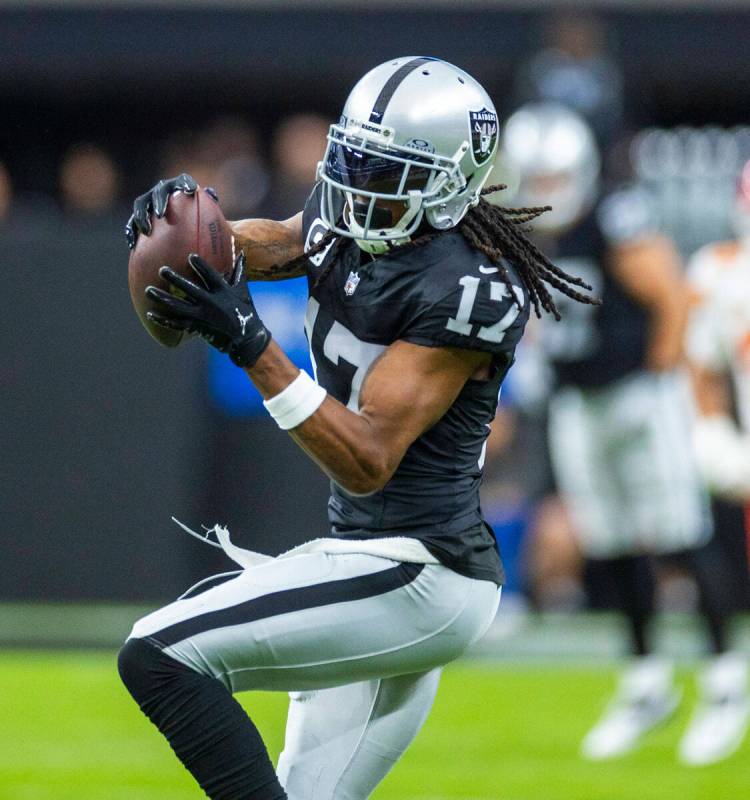 Raiders wide receiver Davante Adams (17) makes a reception during the first half of their NFL g ...