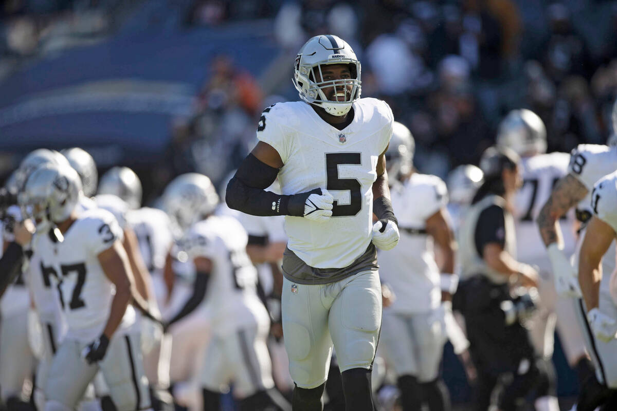 Raiders linebacker Divine Deablo (5) runs on the field before an NFL game against the Chicago B ...