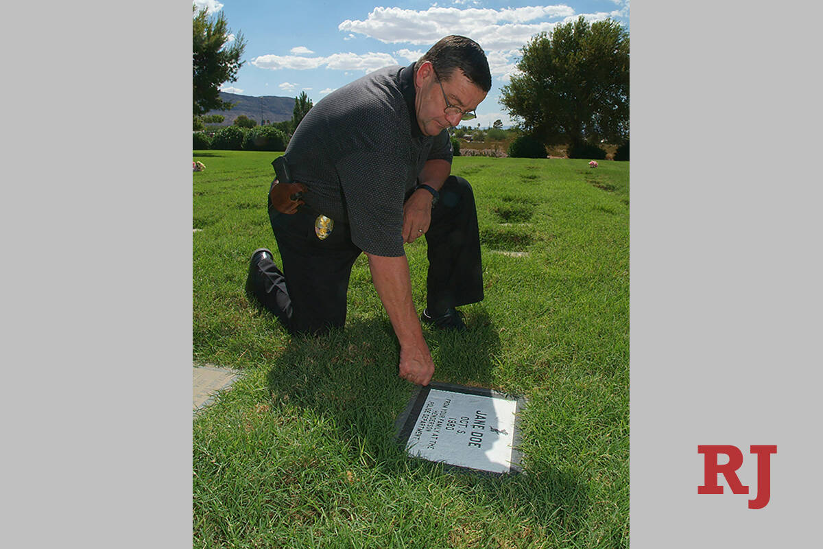 Retiring Henderson police detective John Williams, visits the grave of unidentified teenage mur ...