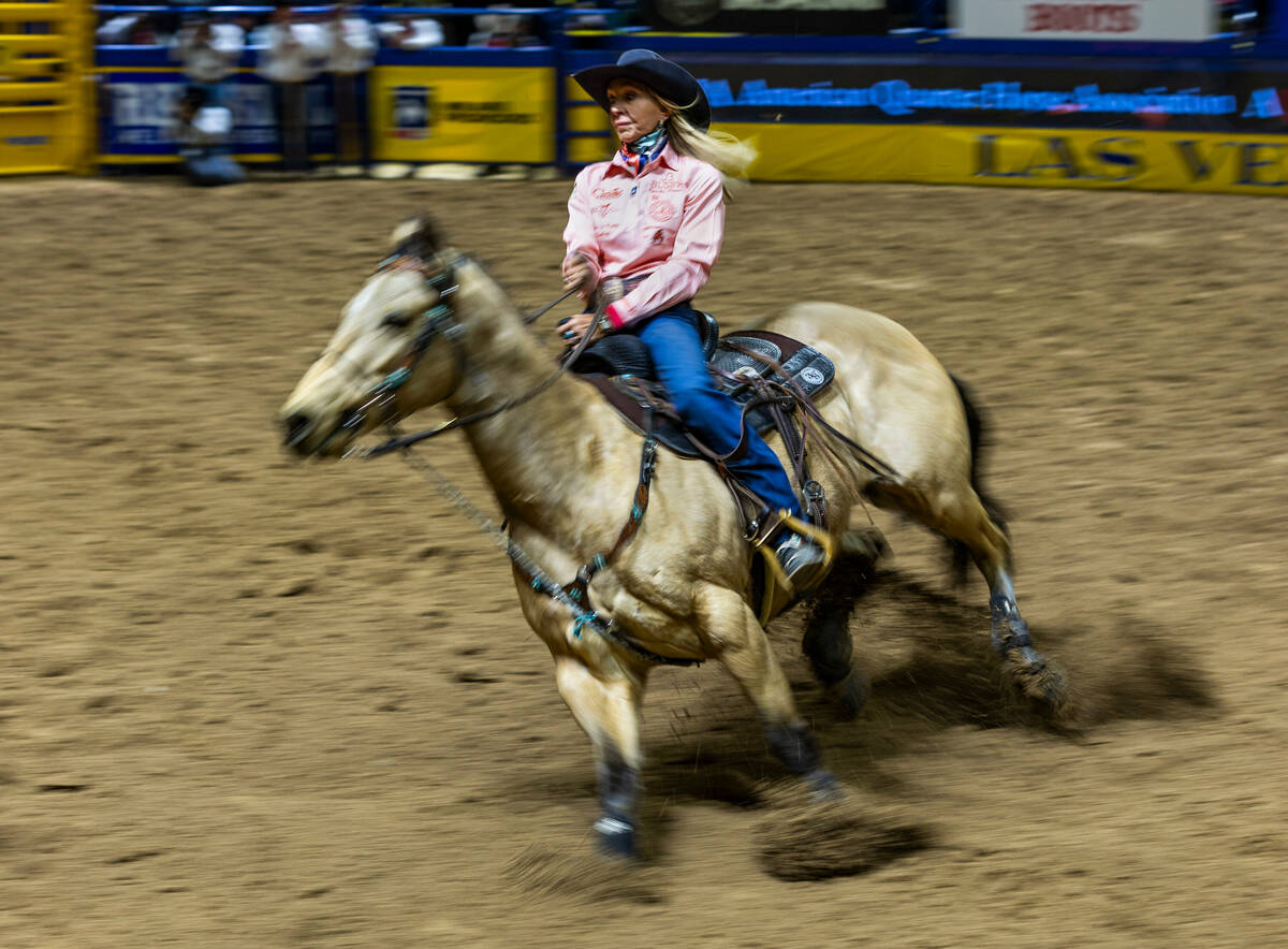 Sue Smith approaches her first turn in Barrel Racing during day 6 action of the NFR at the Thom ...