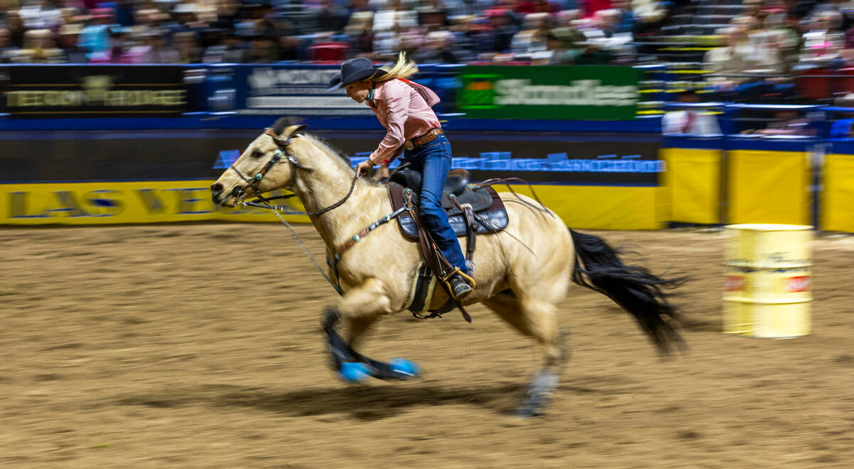 Sue Smith sprints home in Barrel Racing during day 6 action of the NFR at the Thomas & Mack ...