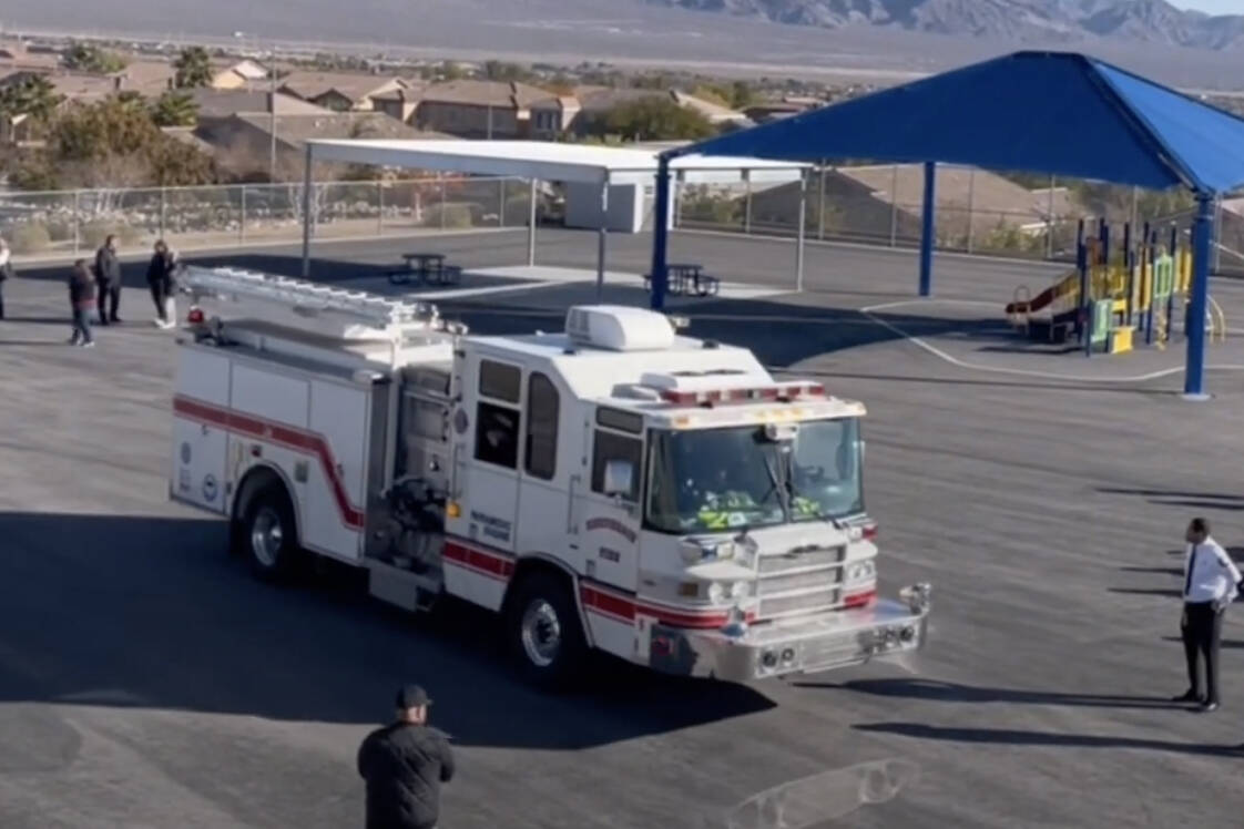 This screenshot from video shows firefighters from the Firefighters of Southern Nevada Burn Fou ...