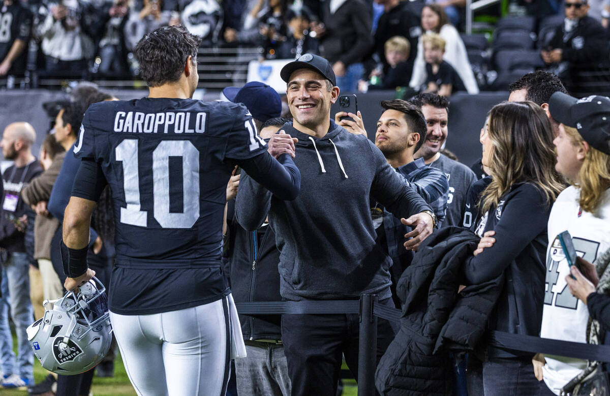 Raiders quarterback Jimmy Garoppolo (10) greets friends on the sidelines during warmups before ...