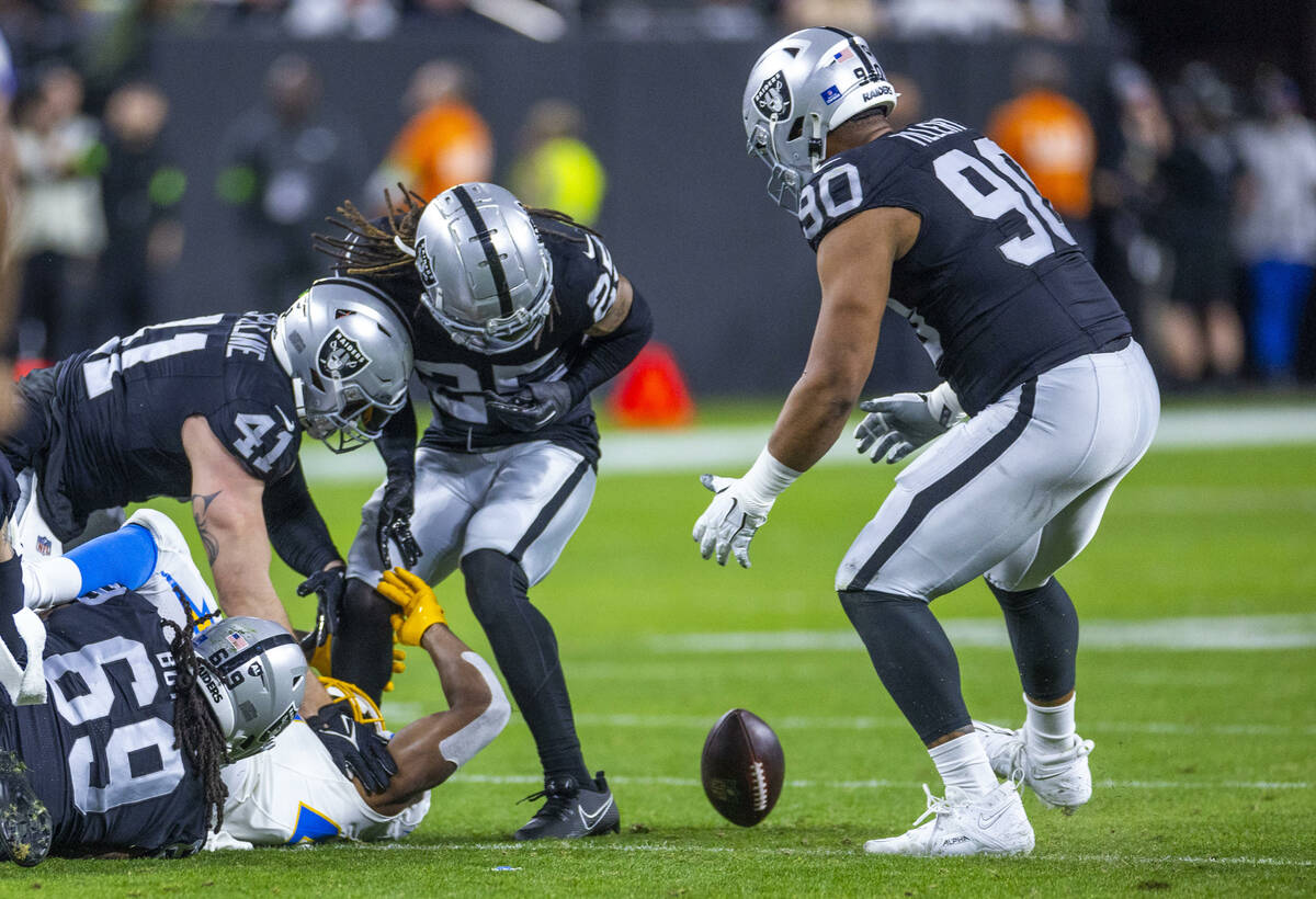 Raiders defenders eye a fumble by the Los Angeles Chargers during the first half of their NFL g ...