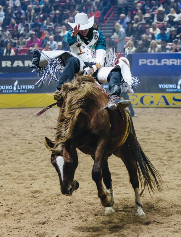 Jayco Roper gets bucked during the National Finals Rodeo at the Thomas & Mack Center on Thu ...